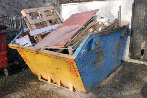 Construction site with waste clearance in progress in Islington